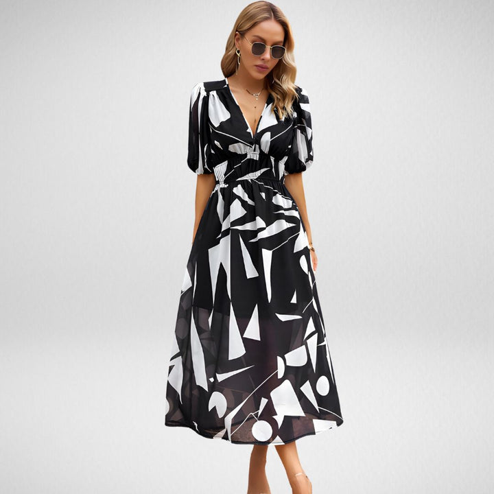 ABBY™| ROBE ÉLÉGANTE À COLl EN V ET MOTIFS VIBRANTS